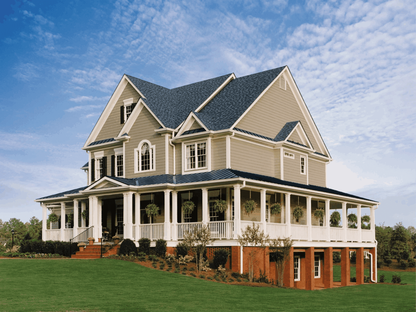 Large countryside house with lush green lawn
